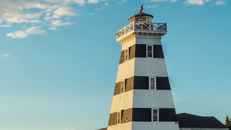A lighthouse with clear blue skys in the background