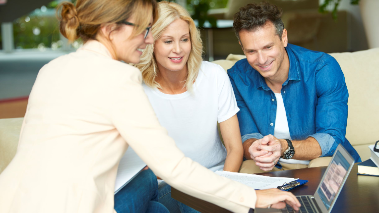 an advisor having a client meeting with a husband and wife