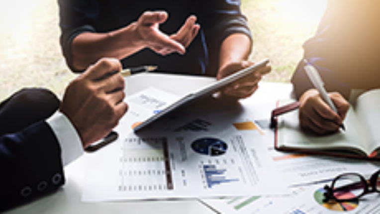 A group of people discussing investment planning