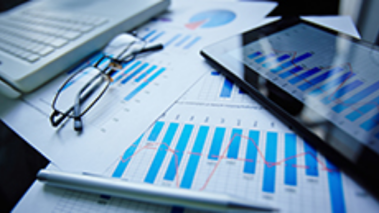 A stack of market reports and analysis