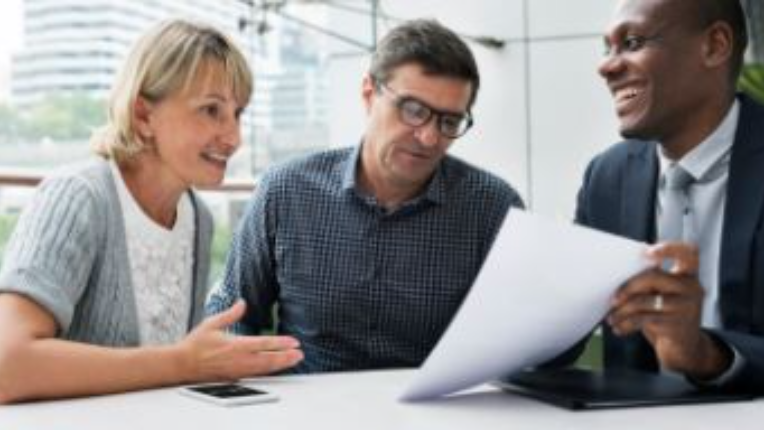 Couple reviewing their finances with their Advisor