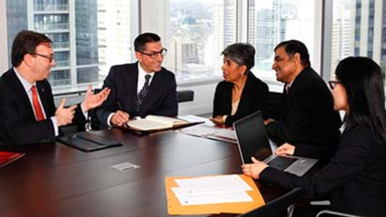 The Slater team at a conference table