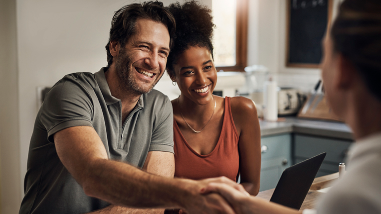 couple meets advisor in their kitchen