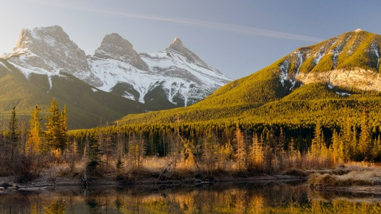 Green mountains with snow.