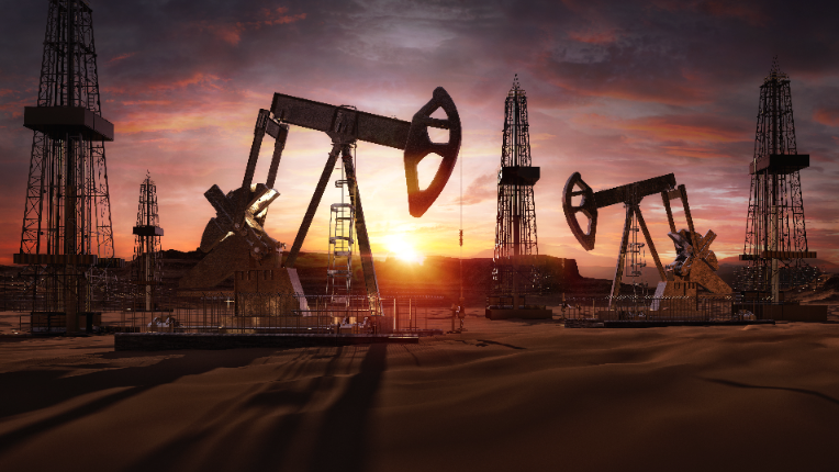 Oil rigs against the backdrop of a sunset