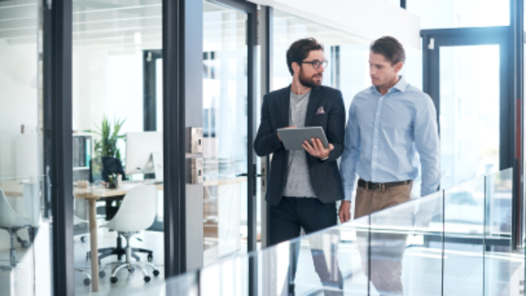 Two people in an office.