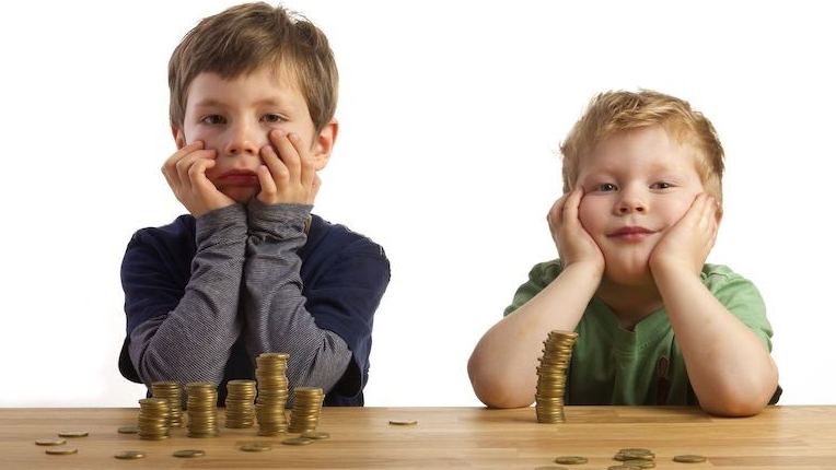 two boys playing with coins
