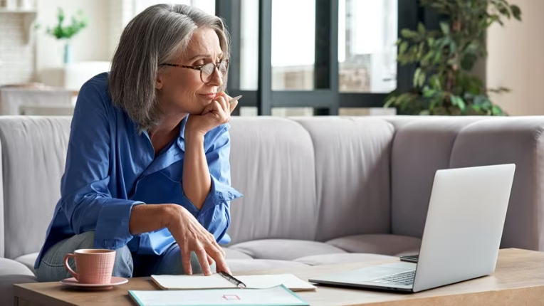 Women looking at a screen.