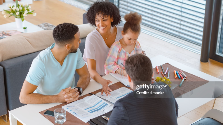Young family having a discussion with an advisor.