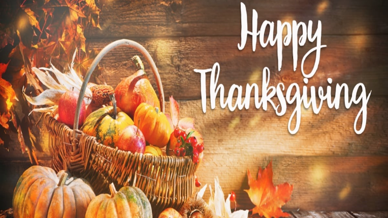 Happy Thanksgiving with a basket of thanksgiving goodies