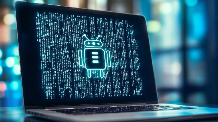 Open laptop with image of robot and coding on screen.