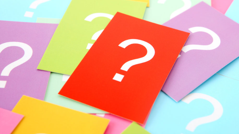Question marks on paper