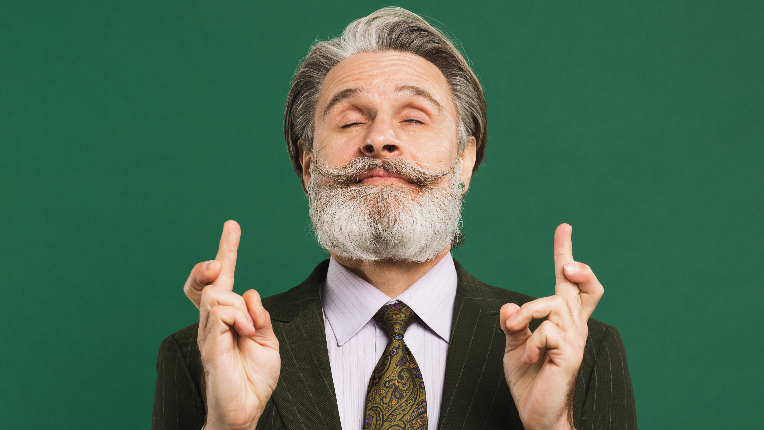 A senior man hopes that his investments will pay off