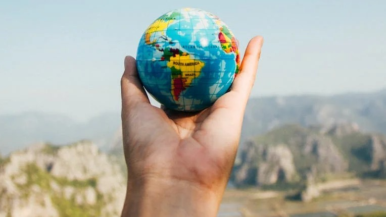 hand holding globe
