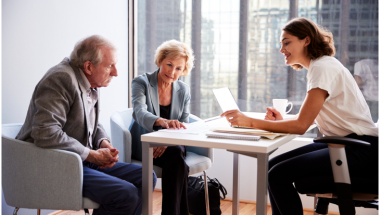 An executive couple meeting with an Advisor.