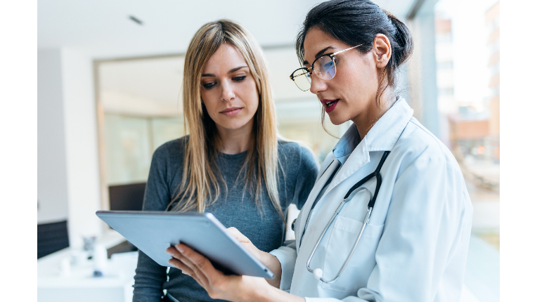 Incorporated physician discussing retirement and corporate planning with a wealth advisor.