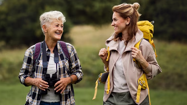 two women with backpacks, one older and one younger