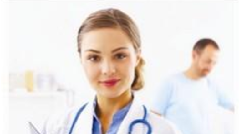 woman in lab coat holding a clip board.