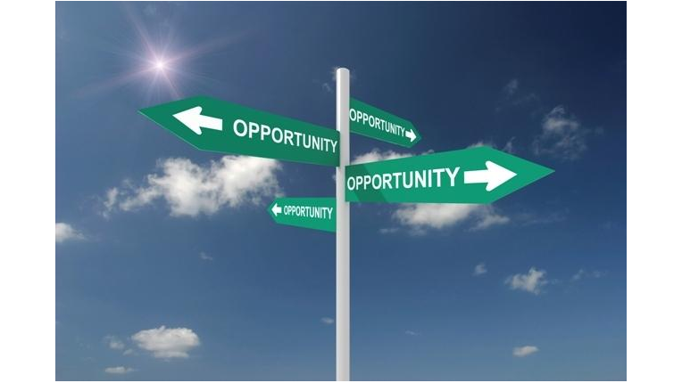 a directional sign pointing in different ways with the word opportunity on them