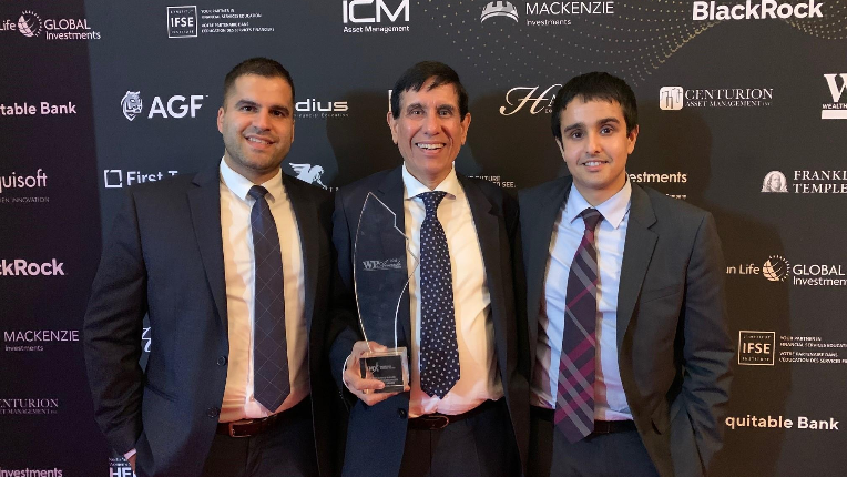 Avin, Ankit and Peter receiving a reward.