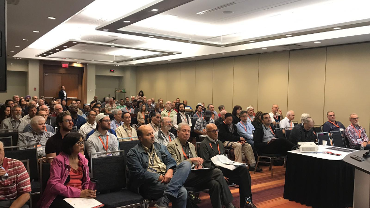 Clients siting and listening to a presentation in a seminar