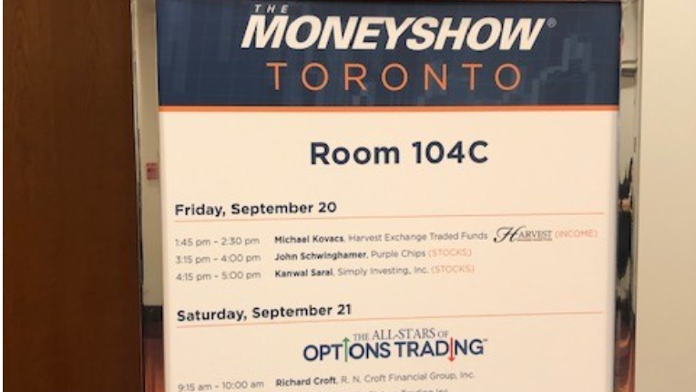 An event banner located in front of a door showing event agenda