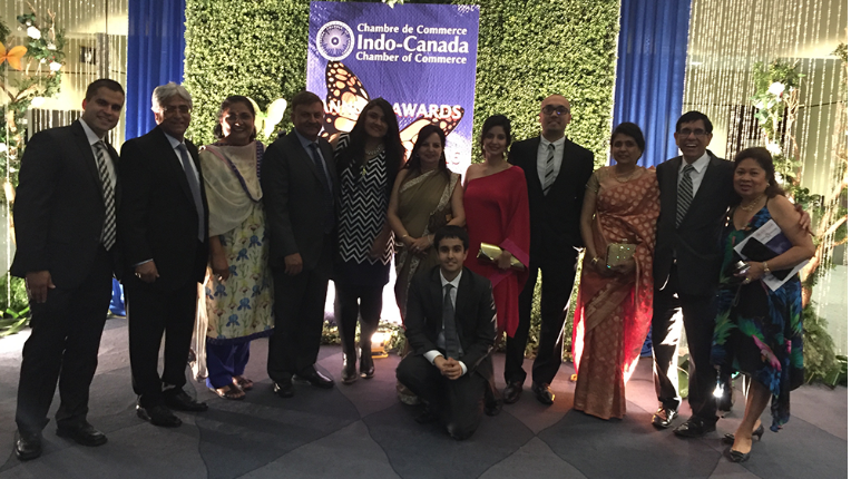 Avin team and family stood together for a photo shot at Indo-Canada Chamber of Commerce event.