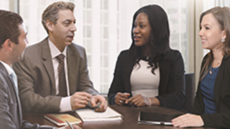 Bard Wealth Management having a conversation at a table