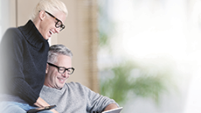 Man and woman looking at a tablet screen