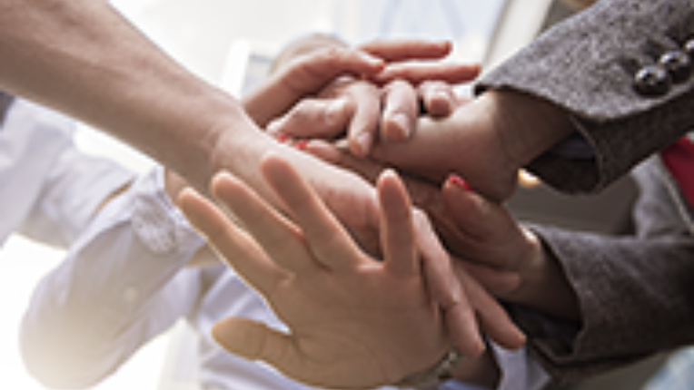 Hands on top of hands