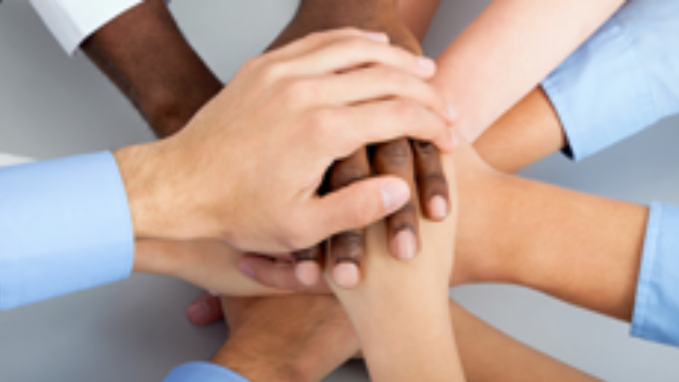 Multiple hands stacking up togerther