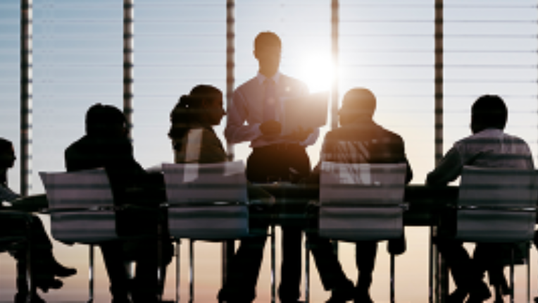 A group of people sitting together and having a discussion