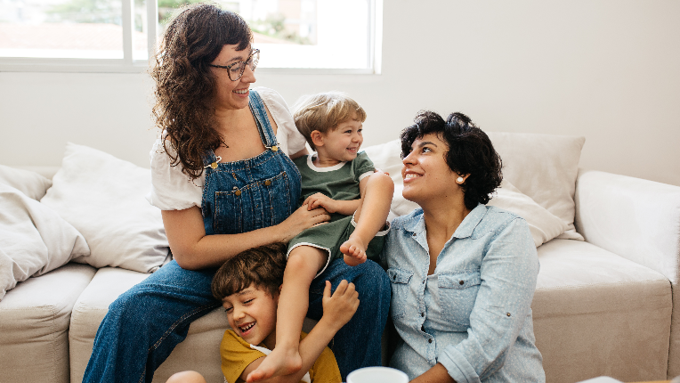 Happy family, two women with two young sons