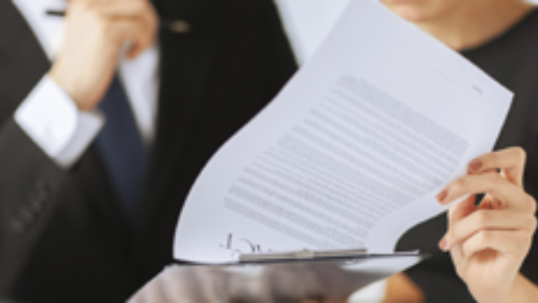 Two people reviewing investment products