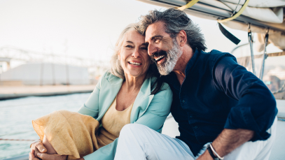 mature couple on a sailboat
