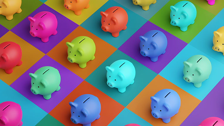 array of piggy banks in saturated colors