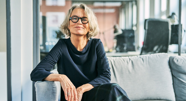 A person sits comfortably in a modern office, reflecting the accessible, client-focused expertise of PKAG in helping clients achieve their retirement goals.