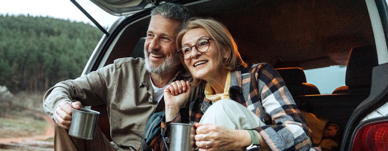 Retired Couple drinking coffee outdoors