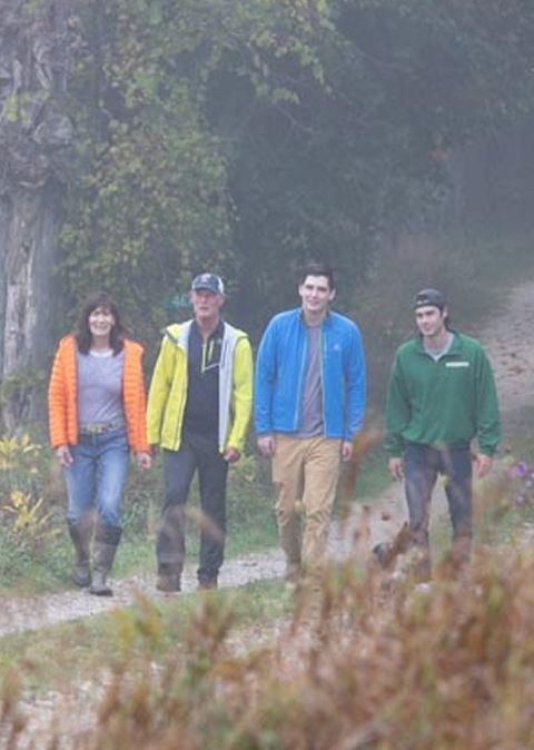 Family walking down a path