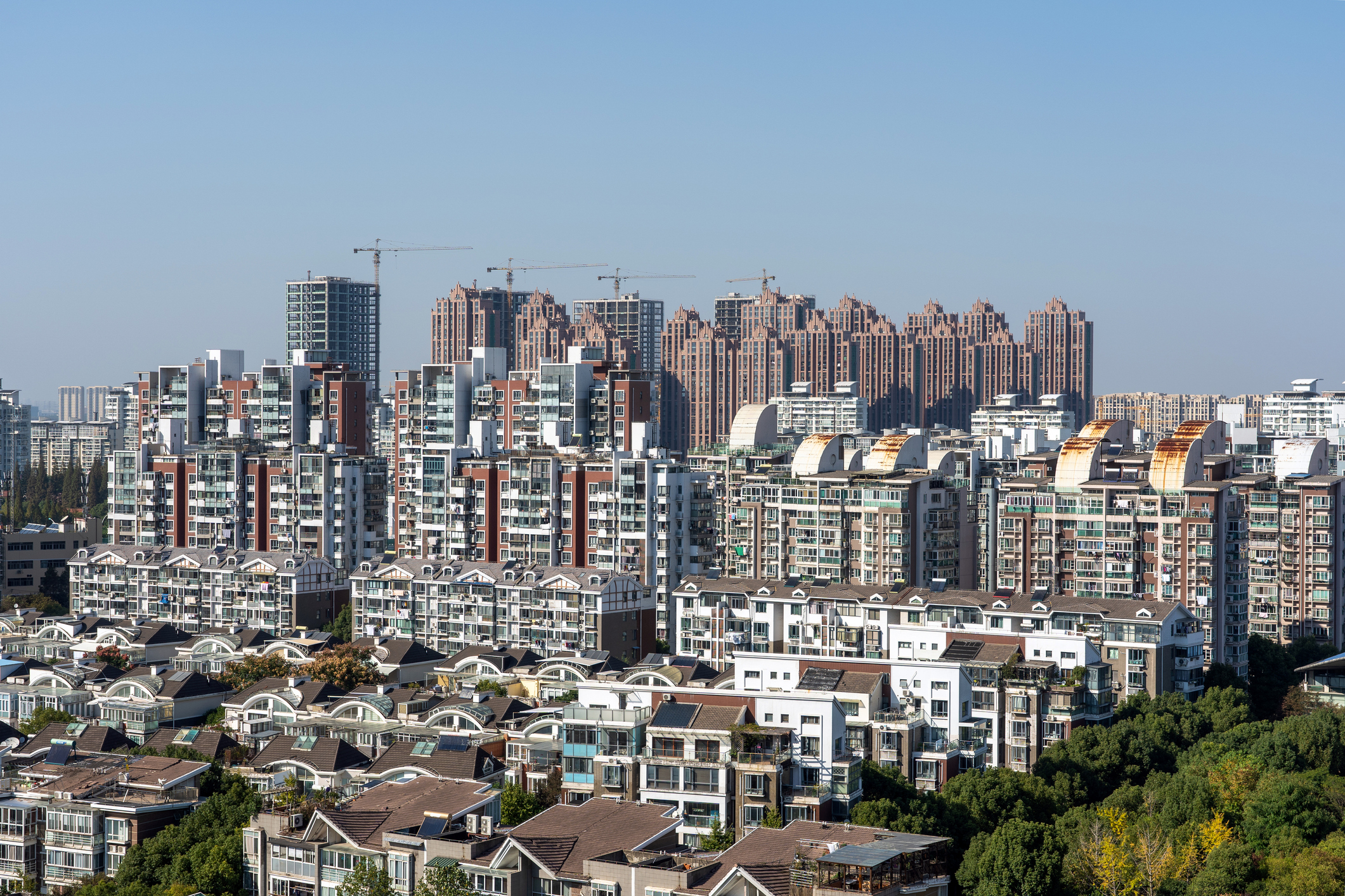Photo of a city in China with homes and apartments buildings