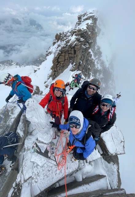 Group climbing mountain