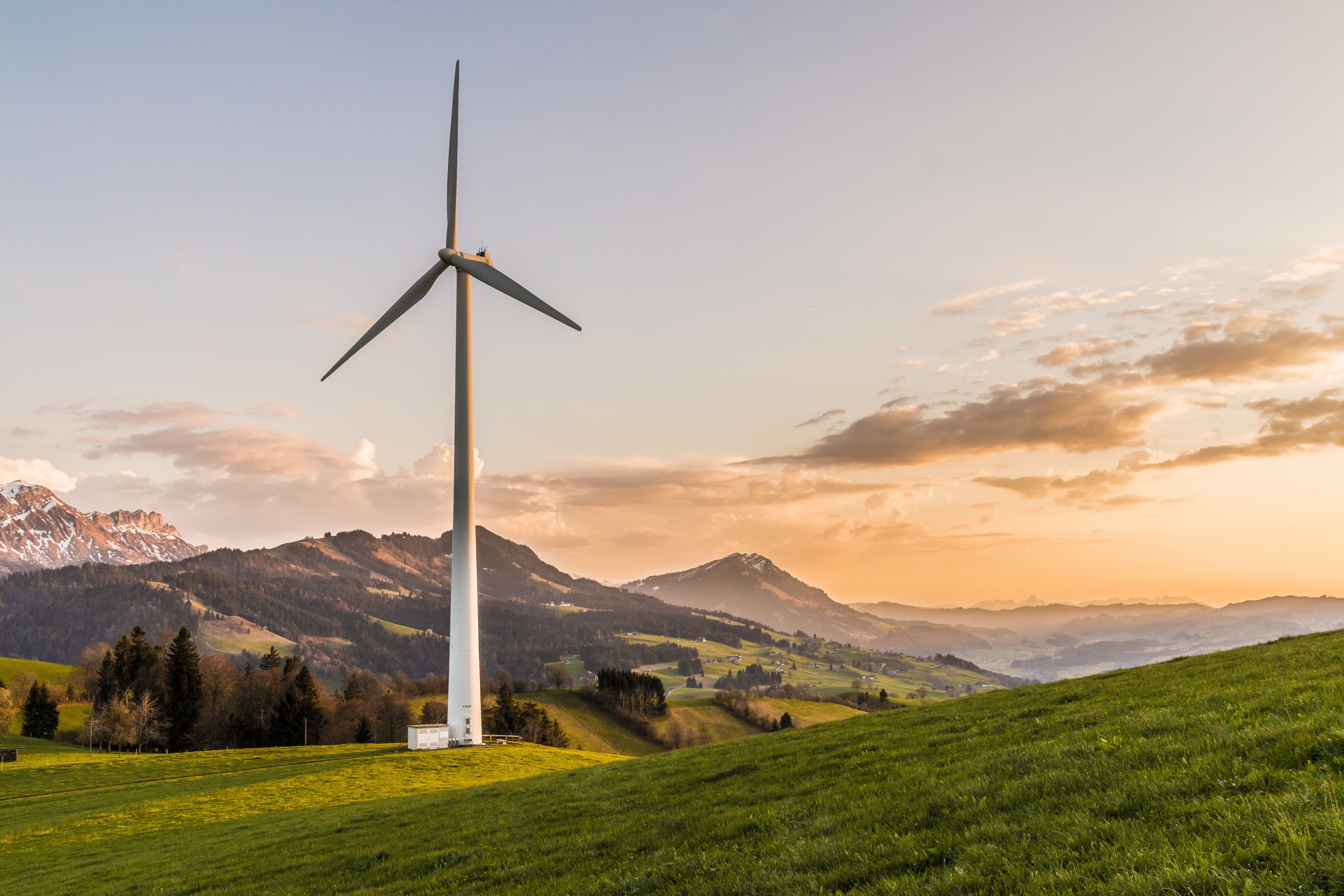Wind turbine overlooking a sunset