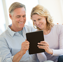 image of couple reviewing their financial accounts on their iPad