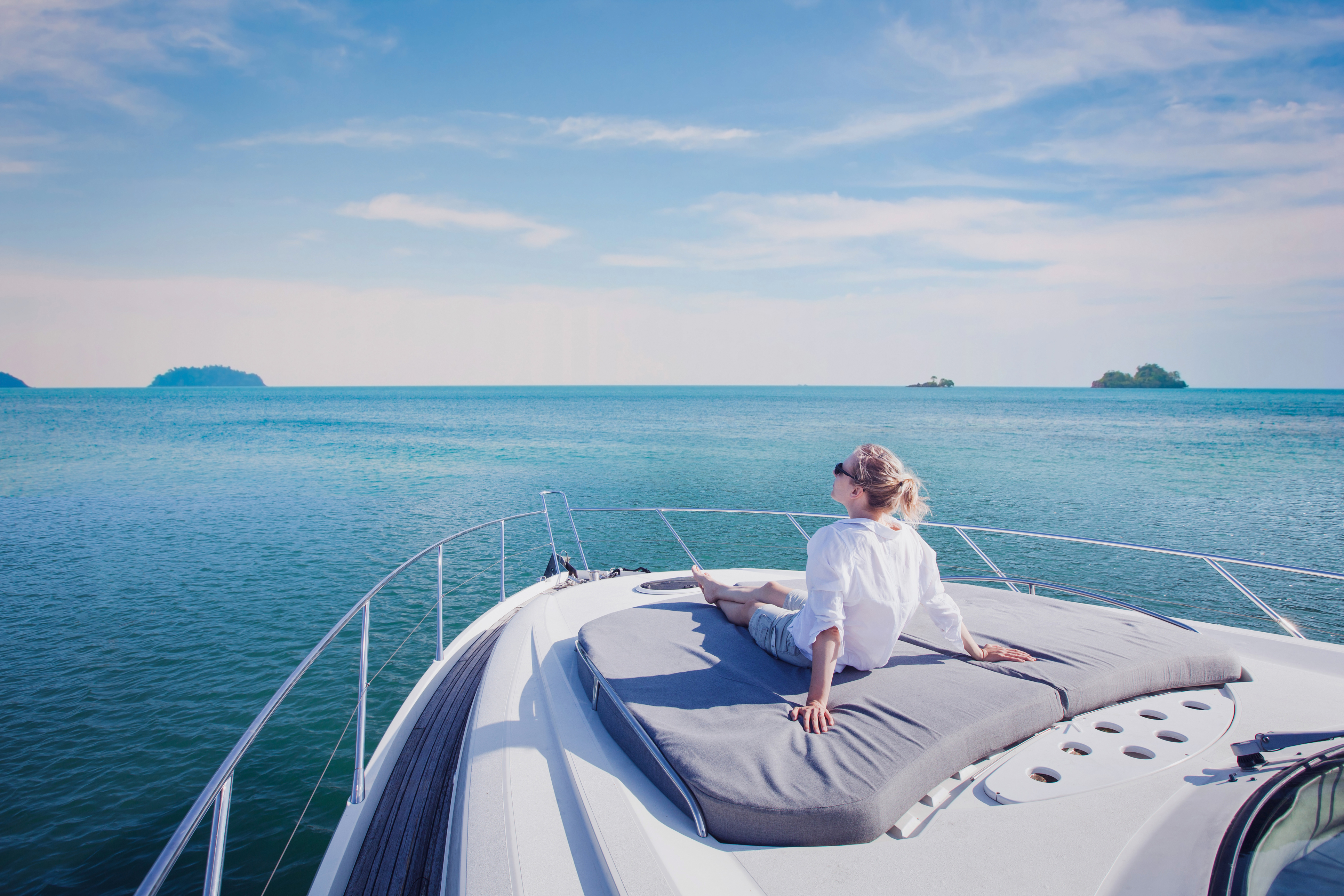 A lady enjoying sunshine on the boat
